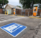 Parking lot with an electric vehicle charging station sign
