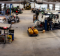 Panorama view of a working warehouse with trucks. 